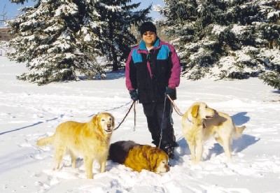 Alvaro with Sheba, Moses and Tigger in the snow.