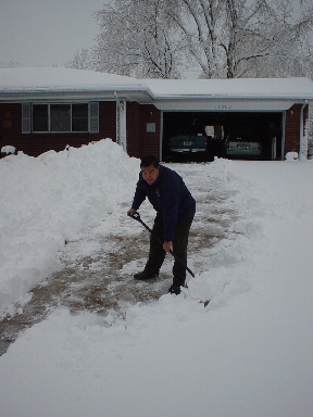 Alvaro - shoveling snow on Day 1.