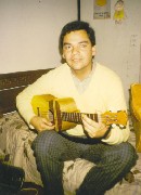 Alvaro playing the cuatro.