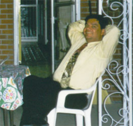 Alvaro casual with tie at home in Denver.