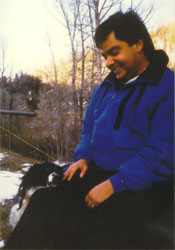 Alvaro in outdoor winter attire - with a new friend at his knee.