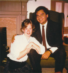 Alvaro with posh suit and tie with Kristin at his side.