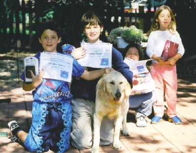Cristobal, Alonso (11 years), Maite (7 years), Tigger and Coni with their awards and prizes (for spending one night in a tent in the back yard) 