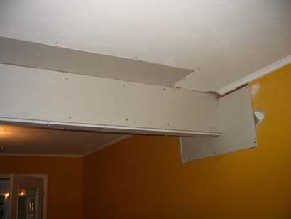 Fixing up the new beam and ugly holes.