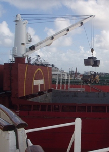 Dump truck being loaded on the ship.