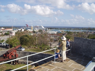 Kristin gazing out over Nassau with our ship in the background.