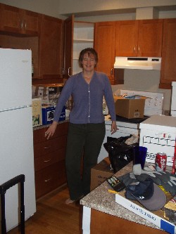 Hild unpacking the kitchen.