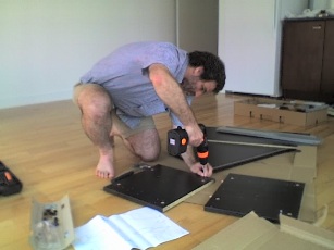 Rob busy assembling a chest of drawers.