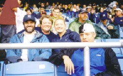 Rob, Kenna, Alyssa and Brandon watching baseball at Yankee Stadium in New York.