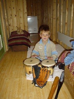 Bjrnar playing bongo drums.