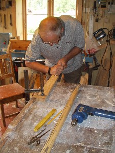 Olav is making a T for playing T-ball with.