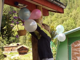 Hild was employed to hang the balloons up around the dinner table.