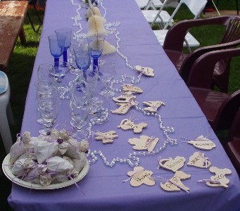 The table with goody-bags, place settings and glasses ready for the champagne.