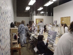 Kristin and the rest of the class learning to paint - by doing.