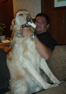 Tigger with his cigar (bone) - taking charge of the sofa.