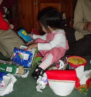 Mikayla opening her presents - Yeah!  A 'cell phone'.