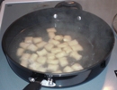 Gnocchi pieces being poached